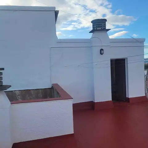 Después: azotea de un edificio con chimeneas